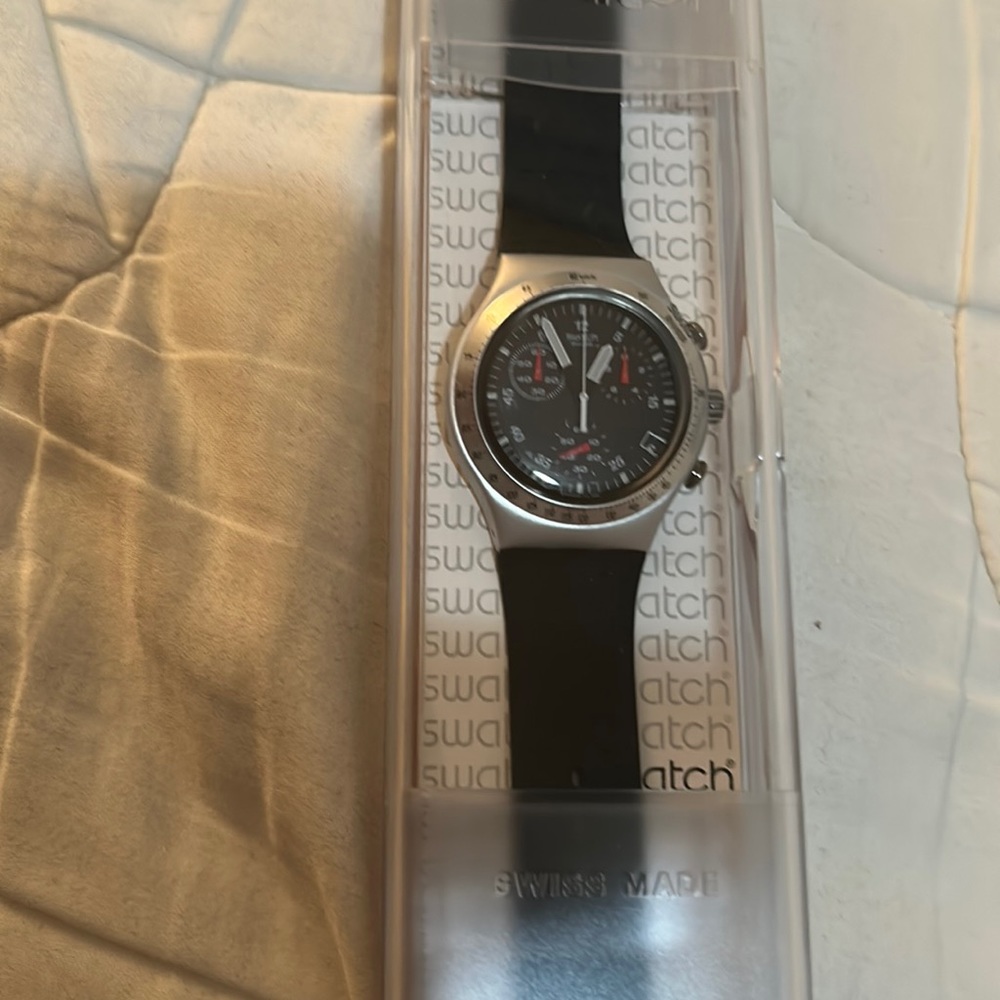 New Black Swatch Watch. Black band. Black and silver. In original box